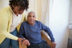 Older man in in a care home: Make a difference by investing in assisted living facilities in the UK.